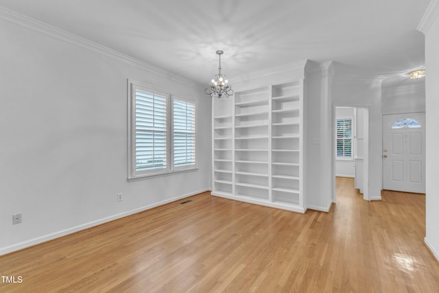 500 Center Pointe Dr, Cary, NC 27513 - empty room with a chandelier, light wood-style floors, baseboards, crown molding, and built in features