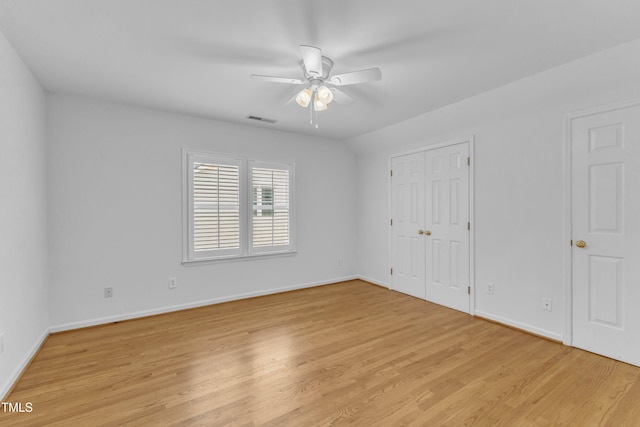 500 Center Pointe Dr, Cary, NC 27513 - unfurnished bedroom with baseboards, light wood-style floors, and ceiling fan