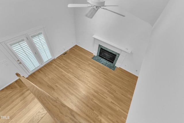 500 Center Pointe Dr, Cary, NC 27513 - unfurnished living room with a ceiling fan, light wood finished floors, a fireplace, and baseboards