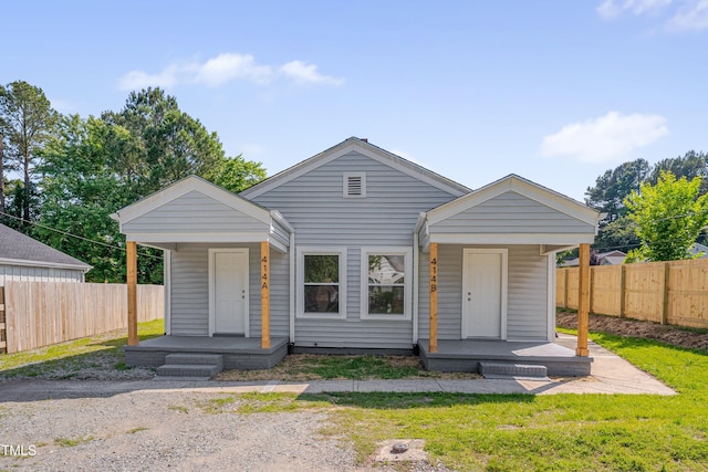 414 Craven St, Durham, NC 27704 - shotgun-style home featuring a porch