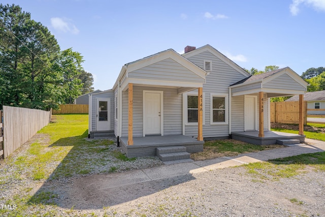 414 Craven St, Durham, NC 27704 - shotgun-style home with a chimney and covered porch