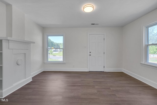 414 Craven St, Durham, NC 27704 - unfurnished living room featuring dark wood-type flooring and baseboards