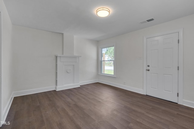 414 Craven St, Durham, NC 27704 - unfurnished living room with dark wood finished floors and baseboards