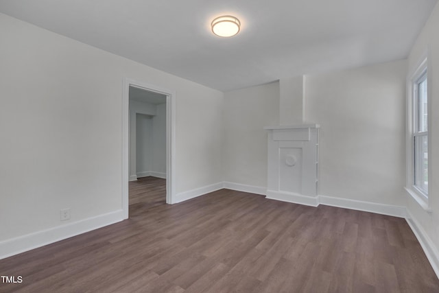 414 Craven St, Durham, NC 27704 - empty room with dark wood-style flooring, plenty of natural light, and baseboards