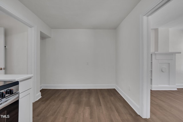 414 Craven St, Durham, NC 27704 - interior space with dark wood-style floors, stainless steel stove, light countertops, and baseboards