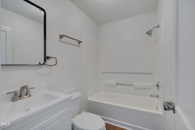 414 Craven St, Durham, NC 27704 - bathroom with toilet, vanity, washtub / shower combination, and wood finished floors