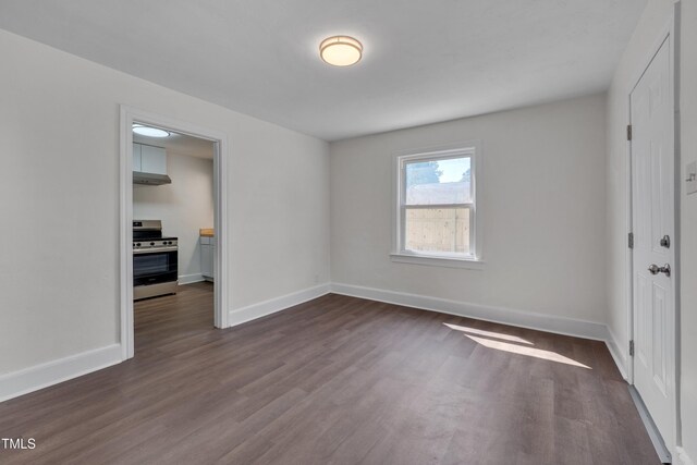 414 Craven St, Durham, NC 27704 - empty room with dark wood-style floors and baseboards