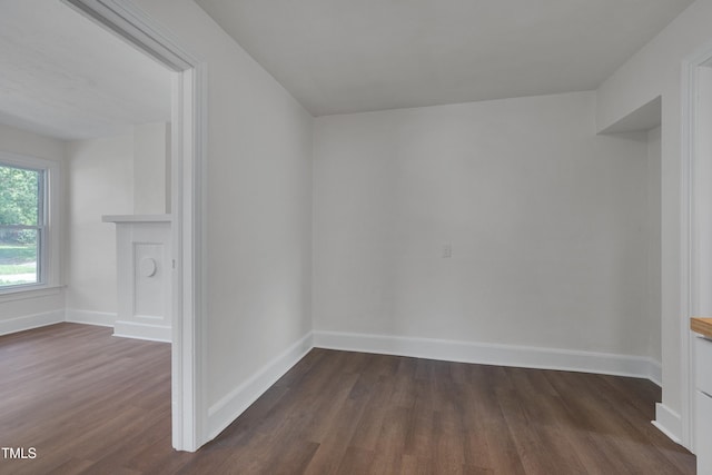 414 Craven St, Durham, NC 27704 - spare room featuring dark wood-style flooring and baseboards