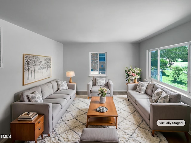 916 Waring St, Durham, NC 27704 - living area featuring baseboards and wood finished floors