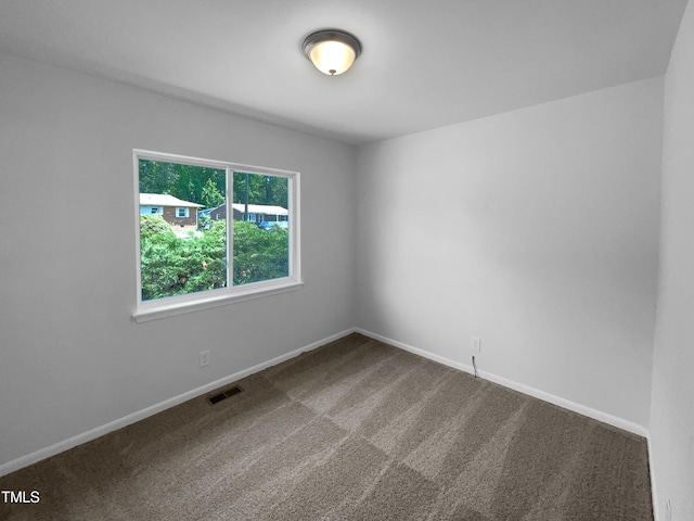 916 Waring St, Durham, NC 27704 - carpeted empty room featuring baseboards