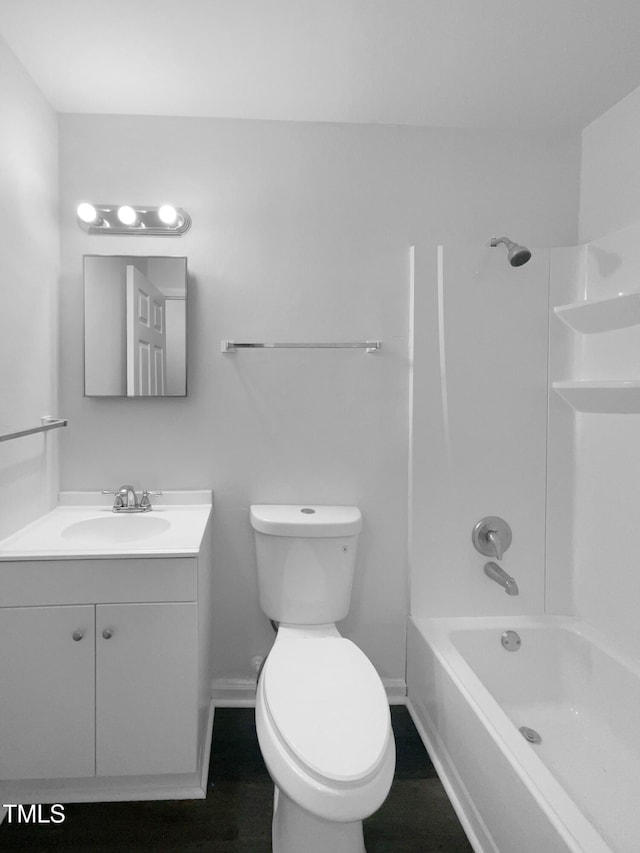 916 Waring St, Durham, NC 27704 - bathroom with vanity, toilet, shower / tub combination, and baseboards