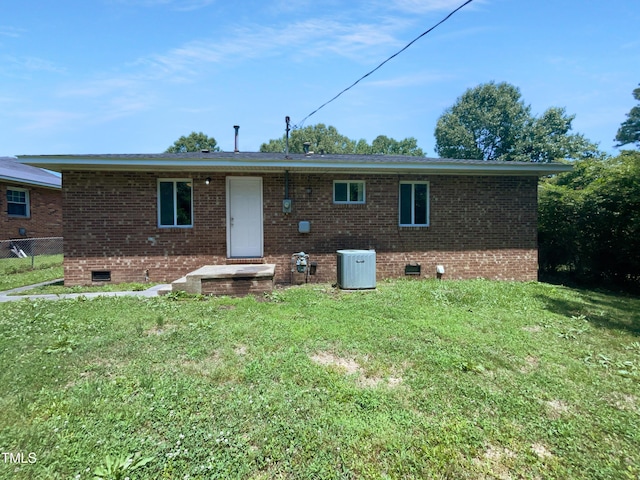 916 Waring St, Durham, NC 27704 - rear view of house featuring crawl space, central air condition unit, and brick siding