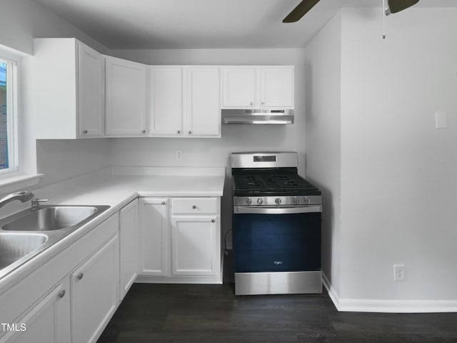 916 Waring St, Durham, NC 27704 - kitchen featuring stainless steel range with gas cooktop, under cabinet range hood, ceiling fan, white cabinets, and dark wood-style floors