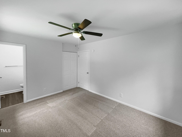 916 Waring St, Durham, NC 27704 - unfurnished bedroom featuring carpet, baseboards, ensuite bath, a closet, and a ceiling fan