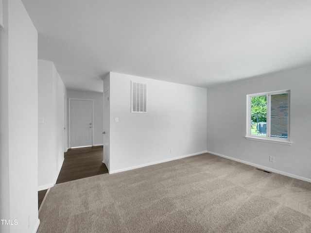 916 Waring St, Durham, NC 27704 - empty room with carpet flooring and baseboards