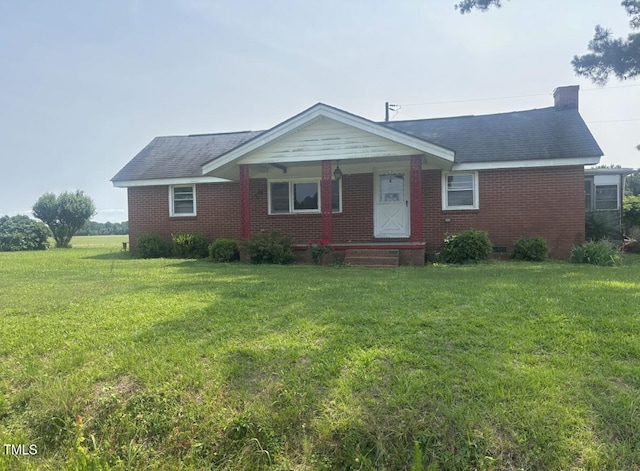 7352 Smokehouse Rd, Stantonsburg, NC 27883 - ranch-style home with a front yard, brick siding, and a porch