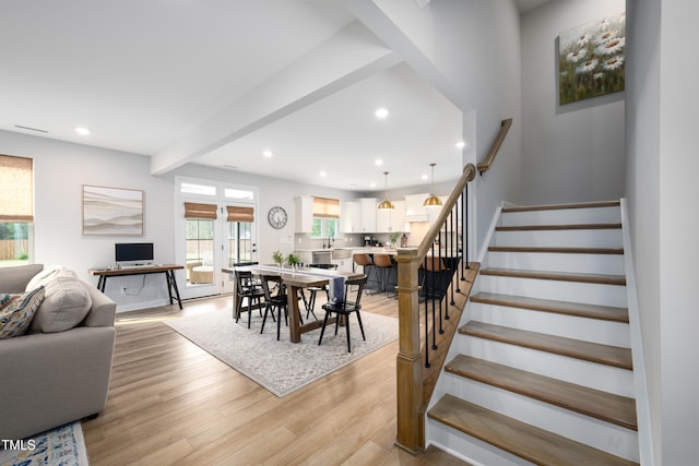 226 Castle Pond Way, Fuquay Varina, NC 27526 - dining space featuring stairway, light wood-style flooring, recessed lighting, and beam ceiling