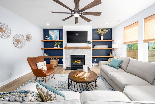 226 Castle Pond Way, Fuquay Varina, NC 27526 - living area featuring ceiling fan, a stone fireplace, wood finished floors, and recessed lighting