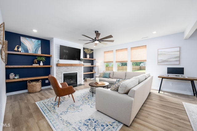 226 Castle Pond Way, Fuquay Varina, NC 27526 - living room with wood finished floors, ceiling fan, a fireplace with flush hearth, recessed lighting, and built in features