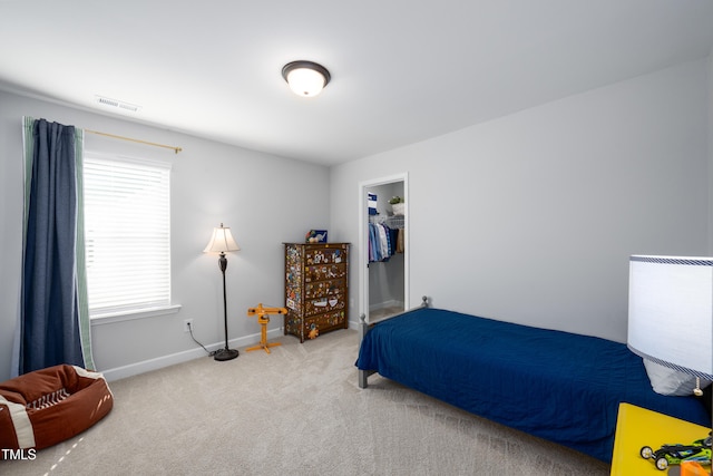 226 Castle Pond Way, Fuquay Varina, NC 27526 - carpeted bedroom featuring a walk in closet and a closet