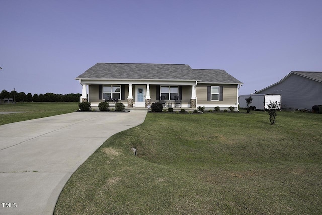 60 Falling Leaf Ln, Benson, NC 27504 - view of front of home with covered porch, driveway, a front yard, and roof with shingles