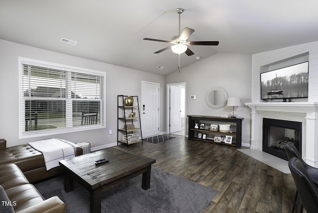 60 Falling Leaf Ln, Benson, NC 27504 - living room with a ceiling fan, wood finished floors, vaulted ceiling, a fireplace, and baseboards