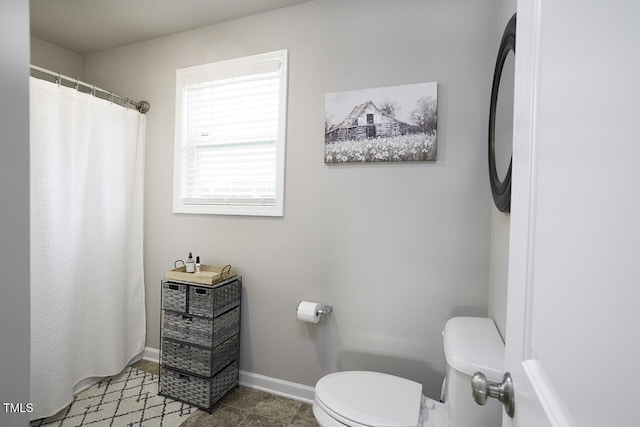 60 Falling Leaf Ln, Benson, NC 27504 - bathroom featuring toilet, a shower with curtain, and baseboards