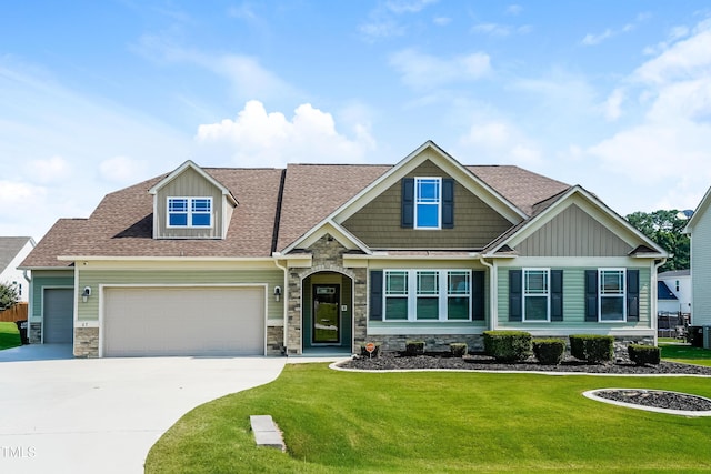 67 Bornean Dr, Garner, NC 27529 - craftsman-style home with stone siding, a garage, driveway, and a front lawn