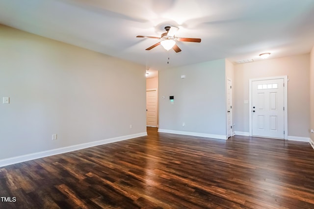 67 Bornean Dr, Garner, NC 27529 - spare room featuring ceiling fan, dark wood-type flooring, and baseboards