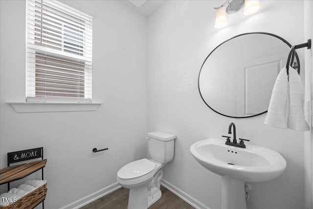 4508 Valley Crest Ln, Fuquay Varina, NC 27526 - bathroom featuring wood finished floors, baseboards, toilet, and healthy amount of natural light