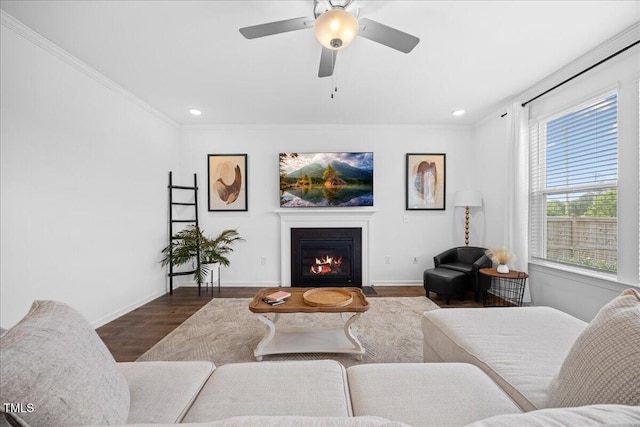 4508 Valley Crest Ln, Fuquay Varina, NC 27526 - living room with a fireplace with flush hearth, wood finished floors, ornamental molding, baseboards, and recessed lighting