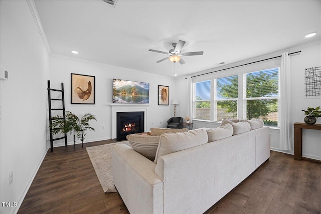 4508 Valley Crest Ln, Fuquay Varina, NC 27526 - living room with a fireplace with flush hearth, dark wood-style flooring, crown molding, ceiling fan, and recessed lighting