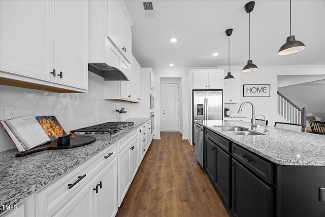 4508 Valley Crest Ln, Fuquay Varina, NC 27526 - kitchen with stainless steel appliances, a sink, white cabinets, decorative backsplash, and recessed lighting