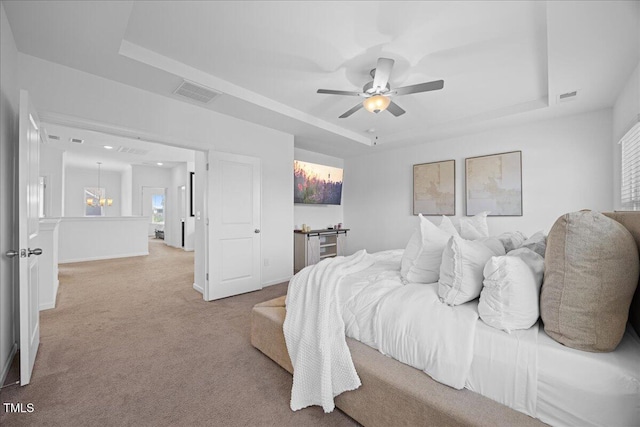 4508 Valley Crest Ln, Fuquay Varina, NC 27526 - bedroom featuring a raised ceiling, carpet flooring, a ceiling fan, baseboards, and a chandelier