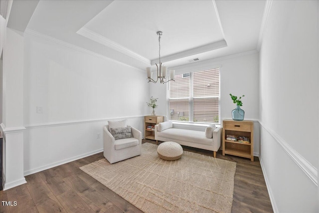 4508 Valley Crest Ln, Fuquay Varina, NC 27526 - living area featuring a raised ceiling, dark wood finished floors, a chandelier, and crown molding