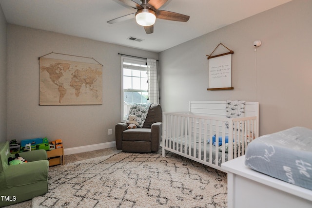 77 Redpine Ct, Clayton, NC 27520 - bedroom featuring carpet flooring, baseboards, a crib, and a ceiling fan