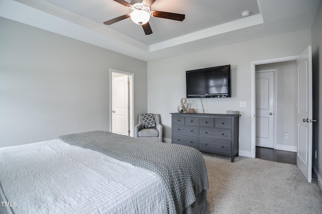 77 Redpine Ct, Clayton, NC 27520 - bedroom with a tray ceiling, carpet floors, baseboards, crown molding, and a ceiling fan