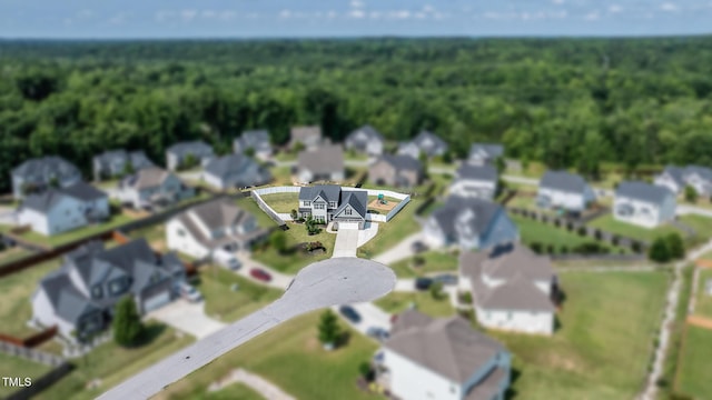 77 Redpine Ct, Clayton, NC 27520 - aerial perspective of suburban area with a forest and property parcel outlined