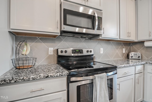 77 Redpine Ct, Clayton, NC 27520 - kitchen with stainless steel appliances, decorative backsplash, and light stone countertops