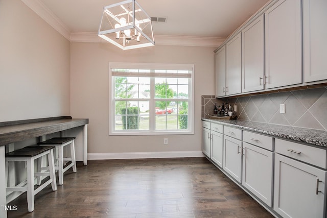 77 Redpine Ct, Clayton, NC 27520 - kitchen featuring a chandelier, crown molding, backsplash, dark wood-style flooring, and baseboards