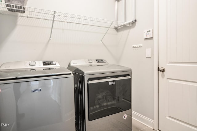 77 Redpine Ct, Clayton, NC 27520 - washroom featuring washing machine and dryer and baseboards