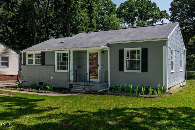 2719 Stratford Dr, Greensboro, NC 27408 - bungalow-style home with crawl space, a front yard, and a shingled roof
