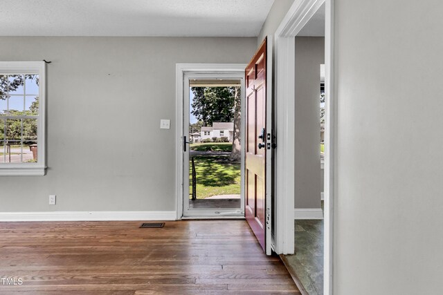 2719 Stratford Dr, Greensboro, NC 27408 - entryway featuring dark wood-style floors and baseboards