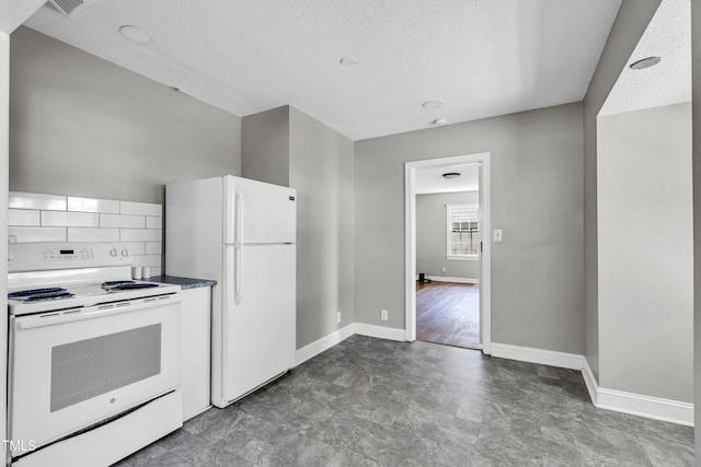 2719 Stratford Dr, Greensboro, NC 27408 - kitchen with white appliances, a textured ceiling, and baseboards