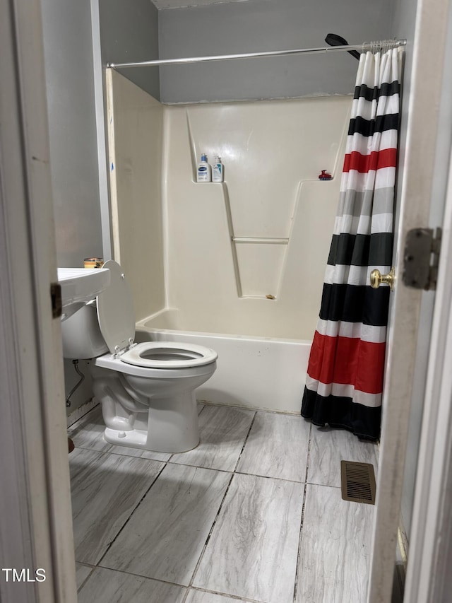 104 Holly Ranch Ct, Willow Springs, NC 27592 - bathroom with toilet and shower / bath combination with curtain