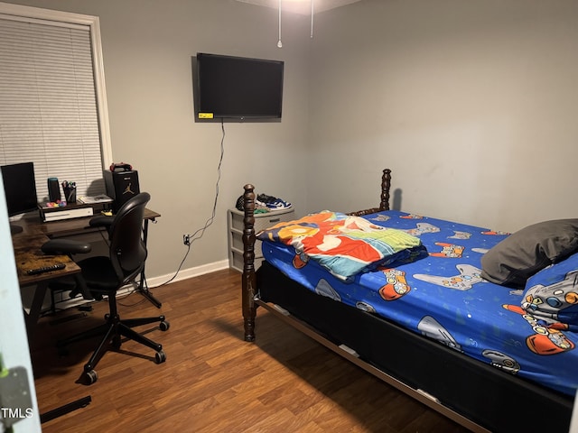 104 Holly Ranch Ct, Willow Springs, NC 27592 - bedroom with wood finished floors and a desk