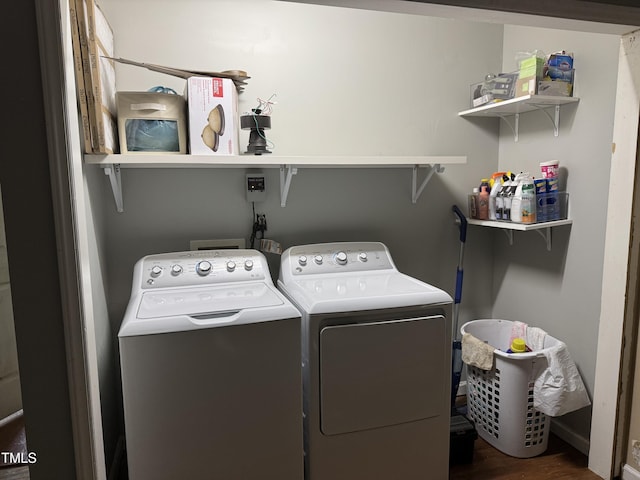 104 Holly Ranch Ct, Willow Springs, NC 27592 - laundry area featuring washing machine and clothes dryer and wood finished floors