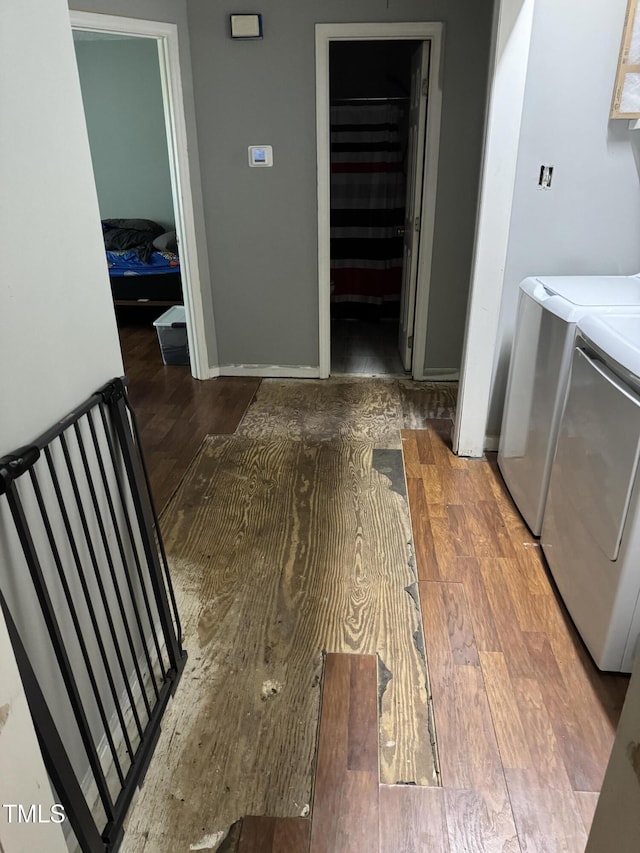 104 Holly Ranch Ct, Willow Springs, NC 27592 - laundry area featuring washing machine and dryer and wood finished floors