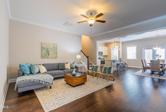 1217 Great Egret Way, Durham, NC 27713 - living area with baseboards, a ceiling fan, stairs, dark wood-style floors, and ornamental molding