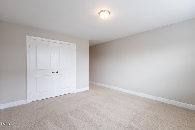 1217 Great Egret Way, Durham, NC 27713 - unfurnished bedroom with carpet, a closet, and baseboards